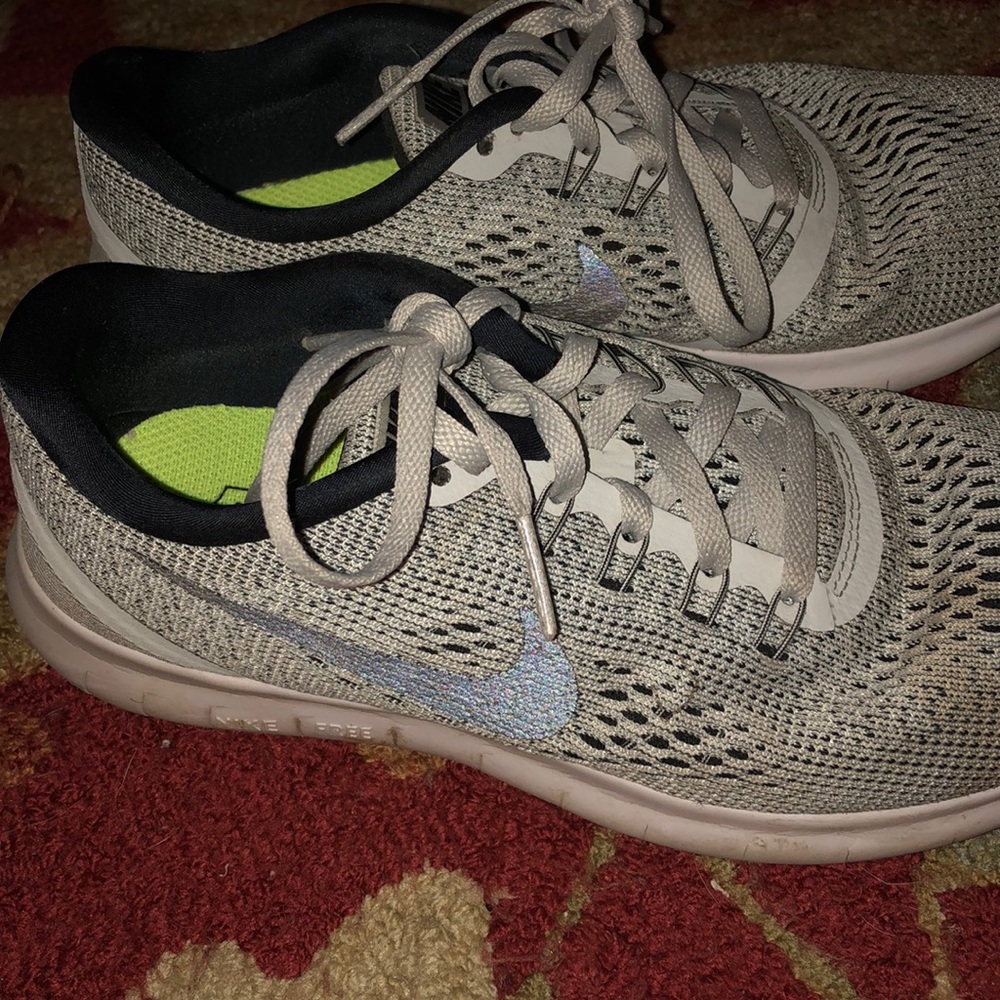 Gray and black nike tennis shoes